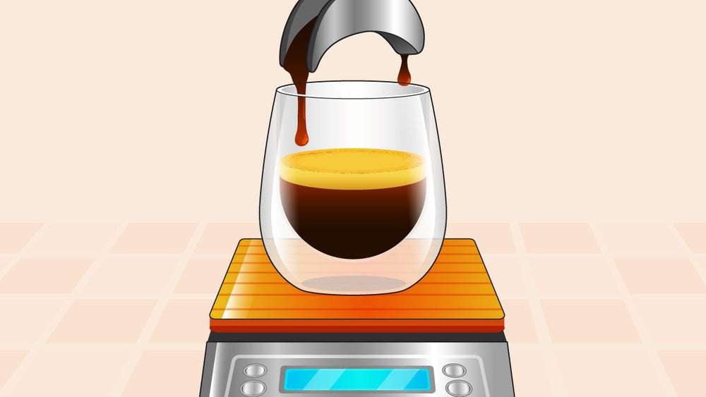 Espresso pouring into a glass on a digital scale with an orange platform.