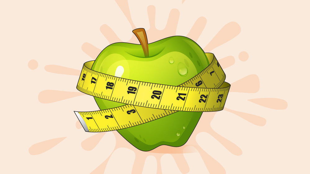 Green apple wrapped with a yellow measuring tape, symbolizing healthy eating and weight management.