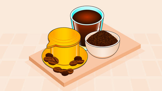 Vietnamese drip coffee setup with a brewed coffee glass, ground coffee bowl, and a yellow coffee filter
