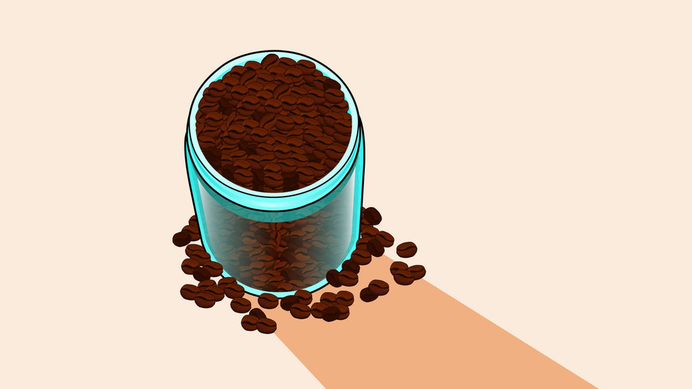 Glass jar filled with coffee beans, spilling onto a surface