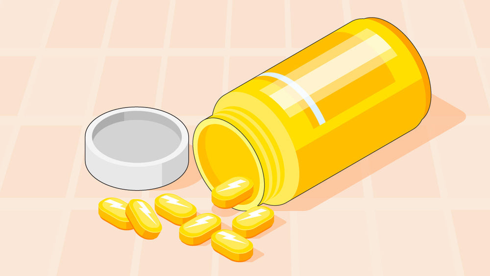 A yellow supplement bottle tipped over with yellow energy pills spilling out.