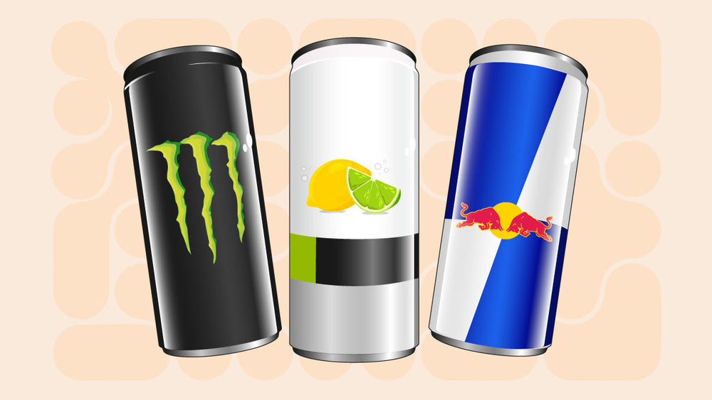 Three energy drink cans including Monster, a citrus-flavored drink, and Red Bull.