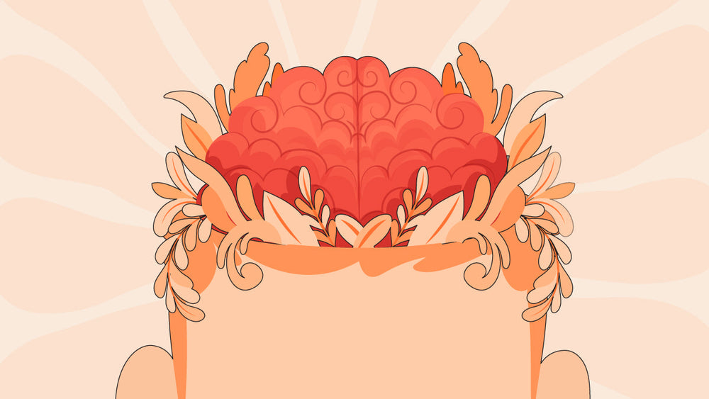 Illustration of a vibrant red brain surrounded by stylized orange leaves.