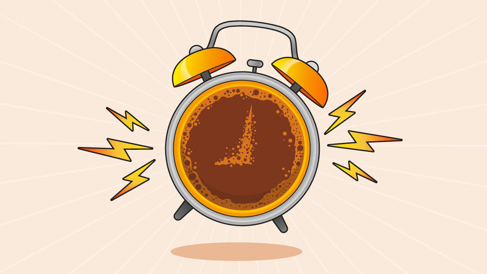 An alarm clock designed like a coffee cup, indicating it is ringing.