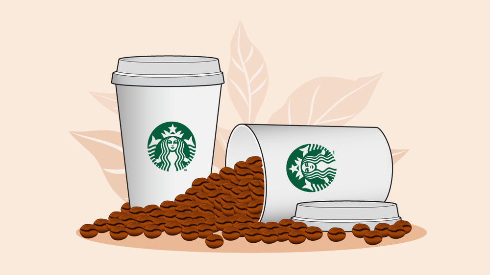 Two Starbucks cups with one full of coffee beans.