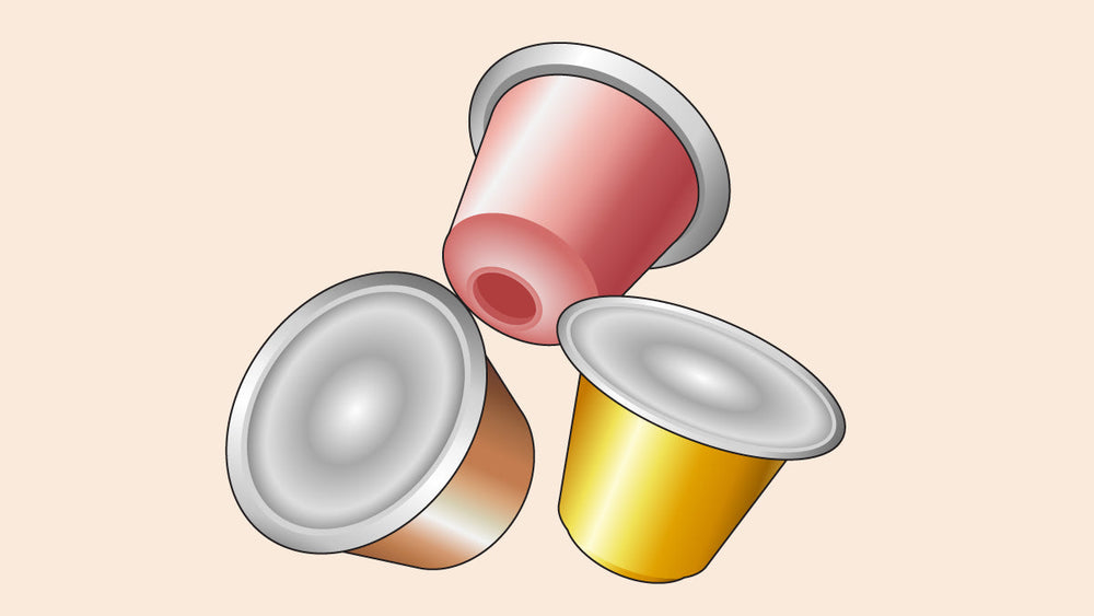 Three colorful coffee pods—red, gold, and bronze—used for single-serve brewing systems.