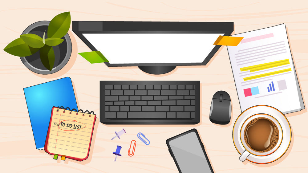 A tidy office desk with a computer, coffee cup, documents, and office supplies.