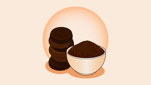 Bowl of ground coffee and stacked coffee grounds discs