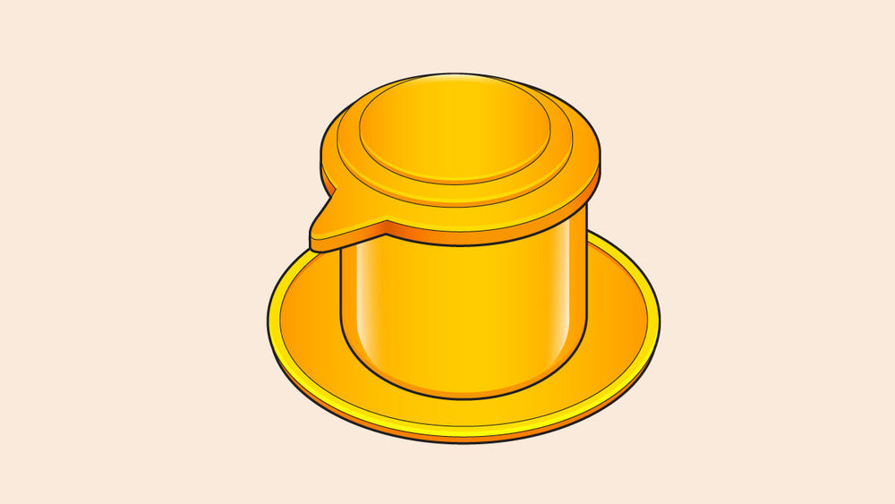 Illustration of a Vietnamese Phin coffee filter in golden-yellow, featuring a lid, brewing chamber, and base plate for traditional slow-drip coffee brewing