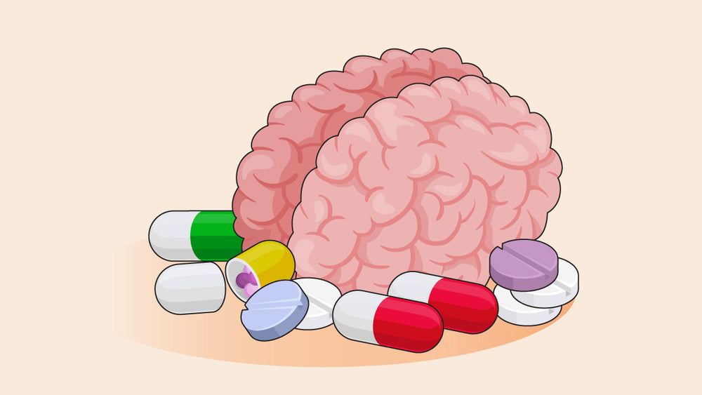 Pink brain surrounded by colorful pills and capsules.