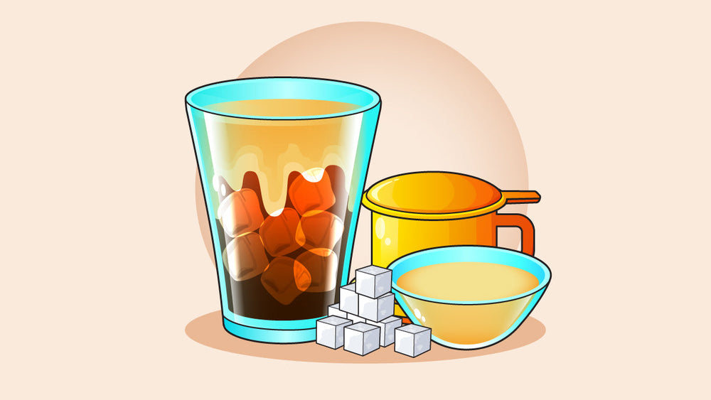 Vietnamese iced coffee with condensed milk, ice cubes, a phin filter, and sugar cubes, highlighting traditional brewing ingredients