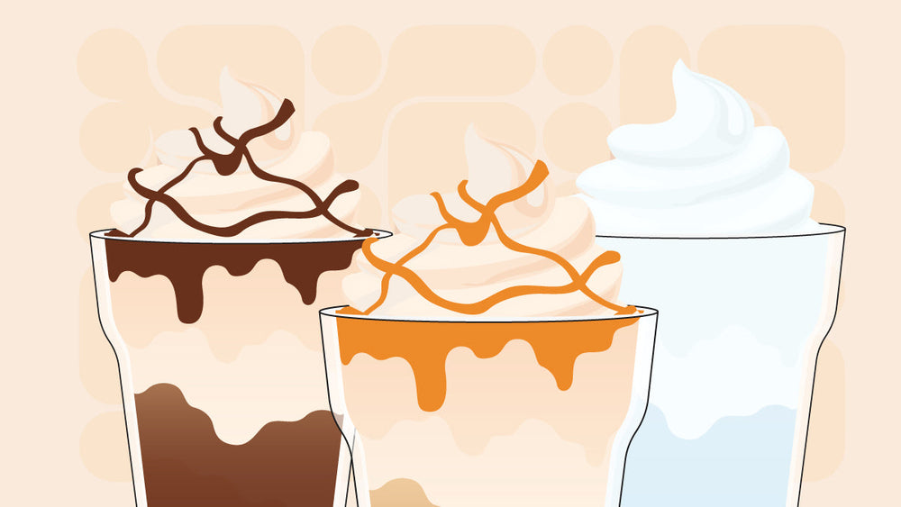 Three iced coffee drinks topped with whipped cream and drizzled with chocolate, caramel, and plain.
