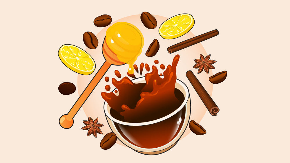 Cup of coffee with splashes, surrounded by honey, lemon slices, cinnamon sticks, star anise, and coffee beans