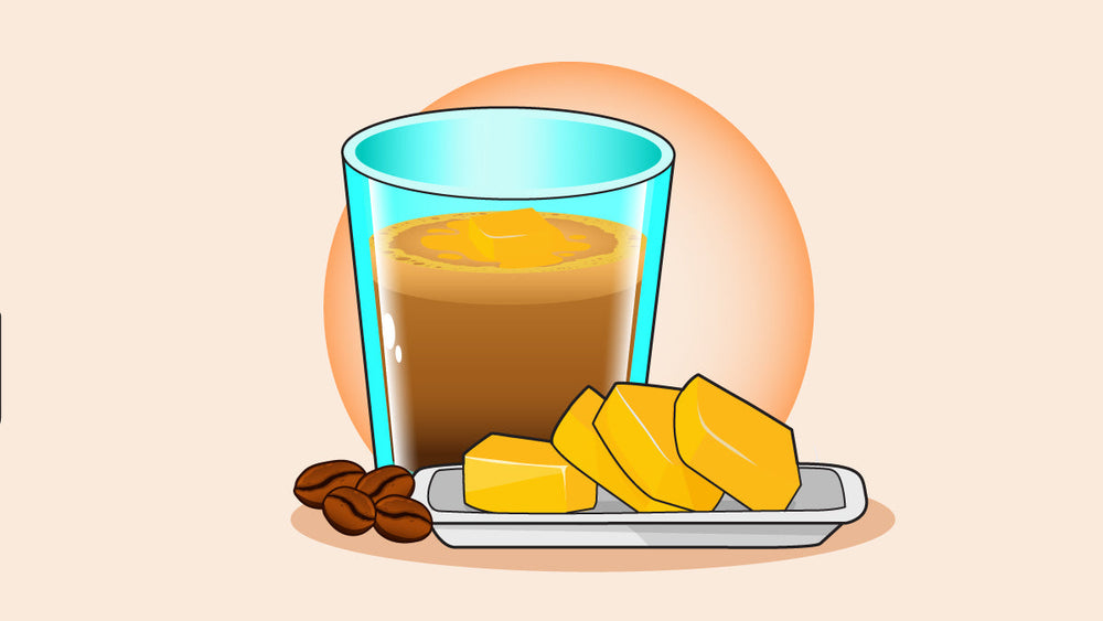 A glass of Vietnamese butter coffee with a slab of butter on top, accompanied by coffee beans and sliced butter on a tray