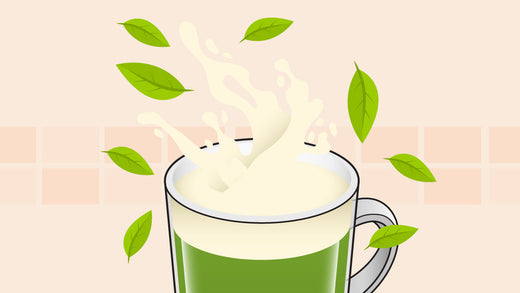 Green tea with creamy splash and floating green leaves