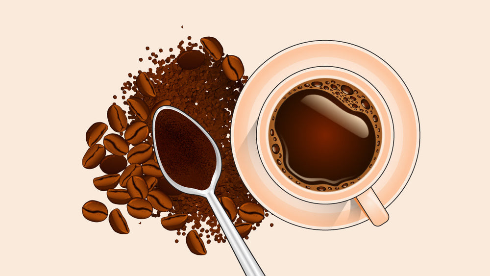 Top-view of a cup of black coffee with whole coffee beans, ground coffee, and a spoon filled with coffee grounds