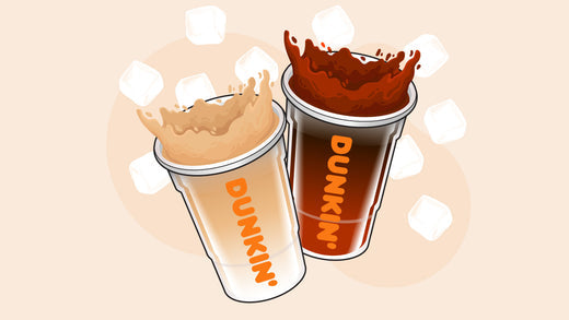 Two Dunkin' iced coffee cups splashing