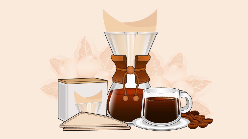 Chemex pour-over coffee setup with filters, a glass carafe of brewed coffee, and a cup beside roasted coffee beans.