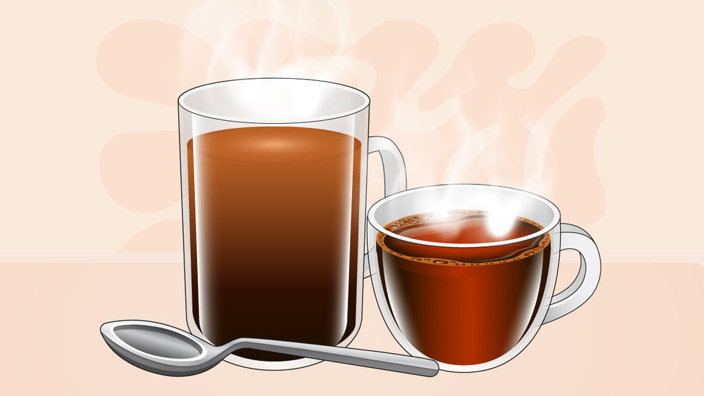 Two steaming cups of hot black coffee with a metal spoon.
