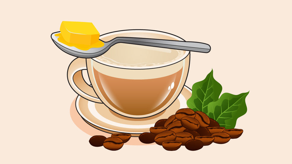 A cup of butter coffee with a spoon holding a melting butter cube, surrounded by coffee beans and leaves